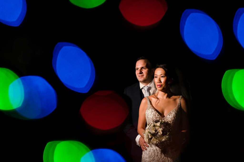 A man and woman posing for a picture. Image by Documentary Wedding Photographer Lewis Bishop Photography.