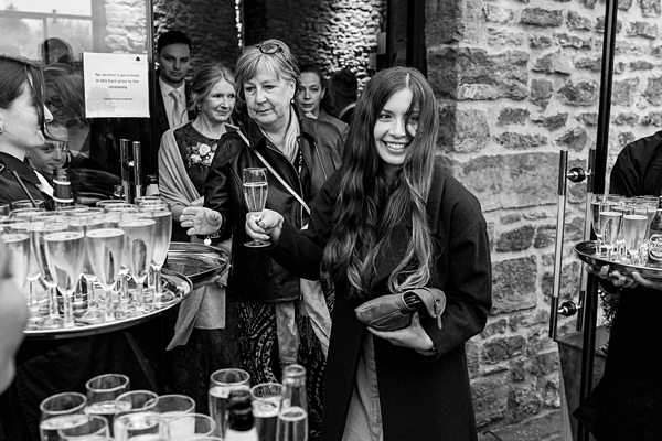Guests enjoying champagne at a social event.