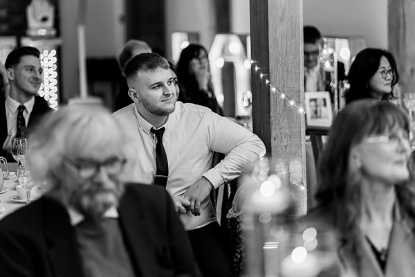 People at social gathering in black and white.