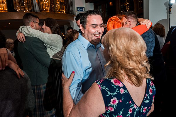 People enjoying a lively indoor dance party.