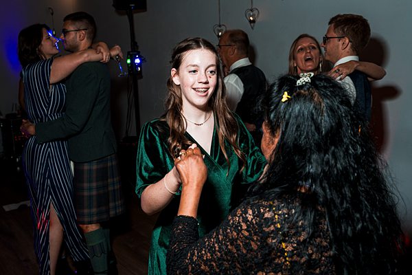 Guests dancing at a festive event.