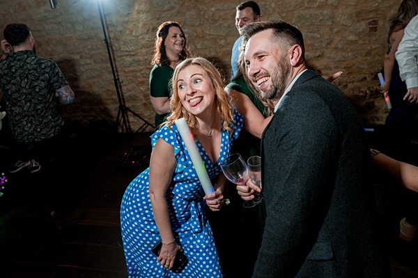 Joyful guests at indoor celebration event.