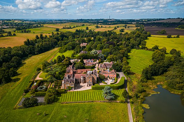 Aerial view of English countryside estate with gardens.