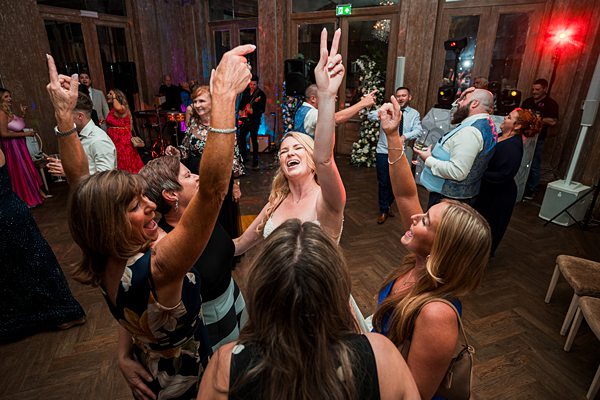 Joyful wedding dance celebration with guests.