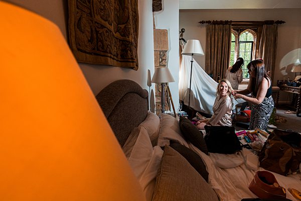 Bridal preparation in a vintage room.