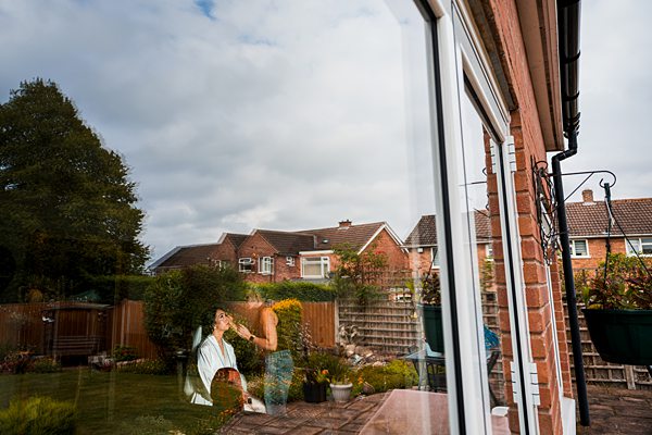 Woman gardening in sunny British backyard