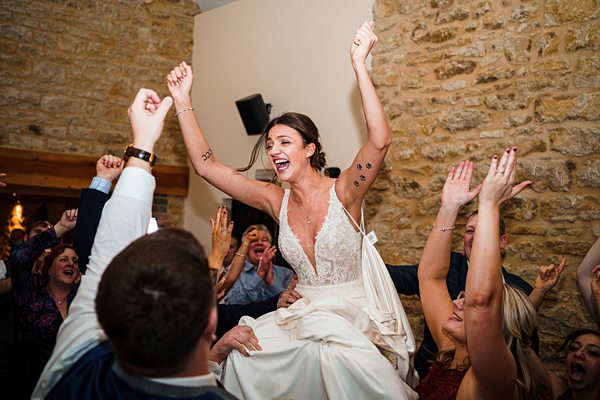 Bride celebrating with guests at wedding reception