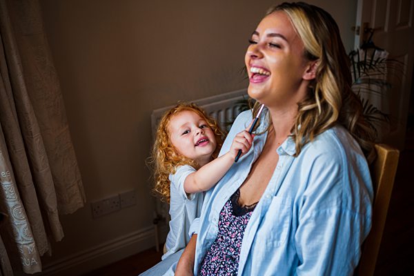 Mother and daughter enjoying playful moment together.
