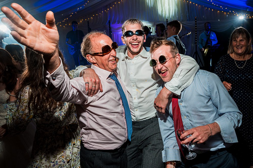 People dancing and celebrating at festive event.