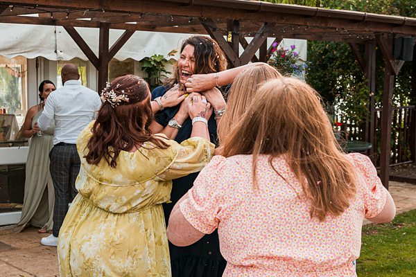 Group of people celebrating outdoors at an event.