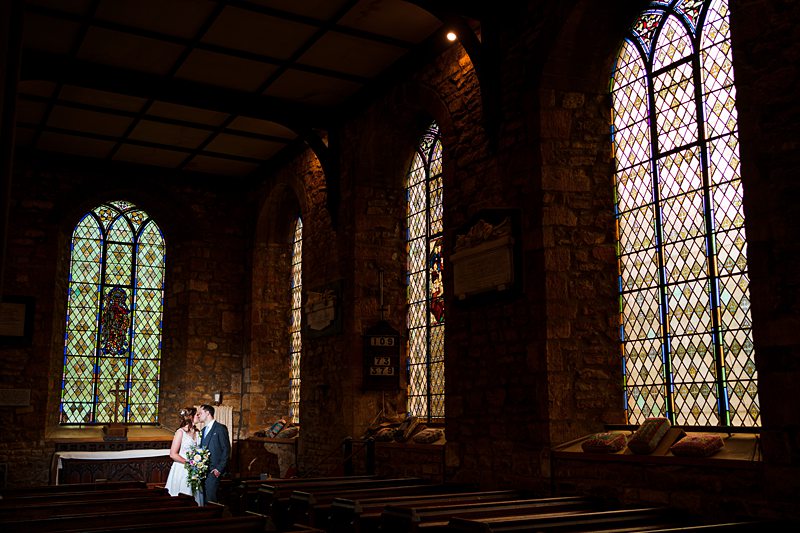 Couple wedding photo in historical church.