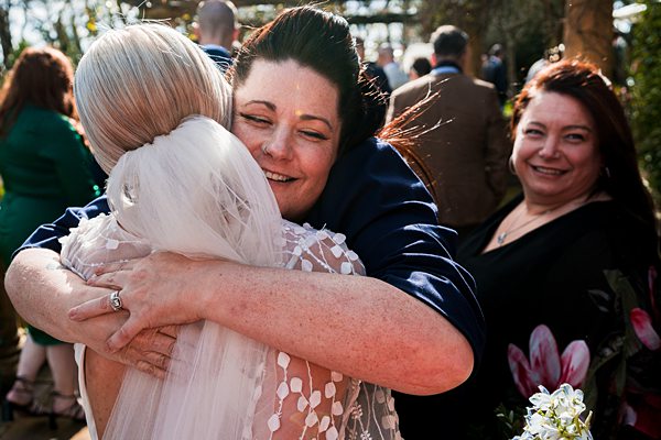 Joyful embrace at a wedding celebration.