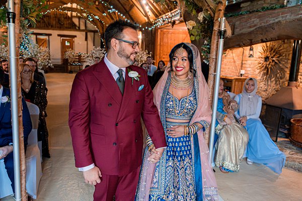 Couple at multicultural wedding ceremony.