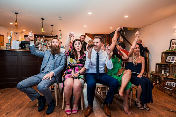 Group of people enjoying at a pub event.