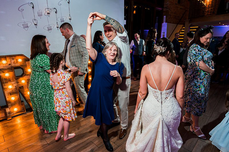 Guests dancing at wedding reception.