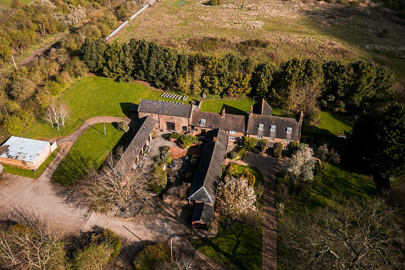 Aerial view of a secluded English country house.