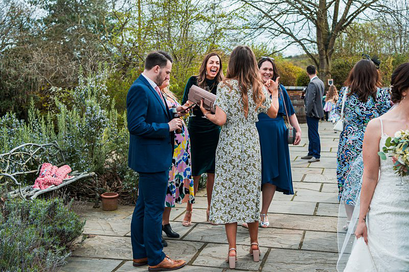 Guests enjoying outdoor wedding reception.