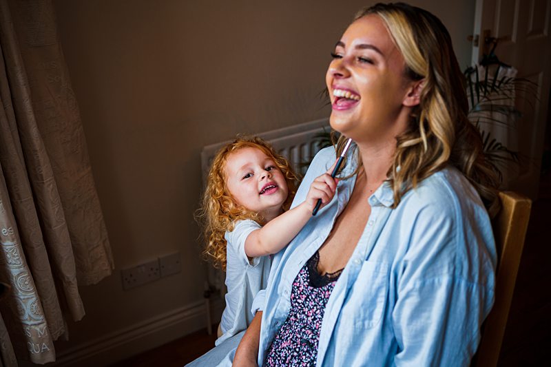 Mother and child enjoying playful moment at home.