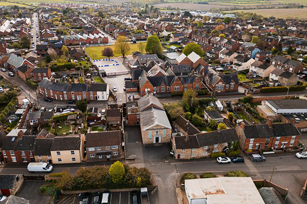 Aerial view of a typical British suburban neighbourhood.