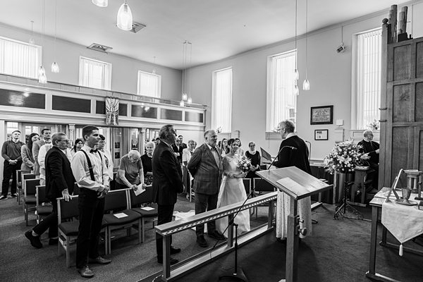 Wedding ceremony in progress at a church.