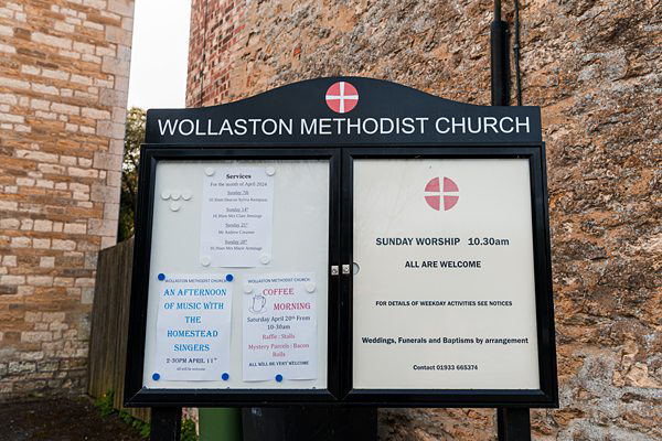 Wollaston Methodist Church service notice board outside.