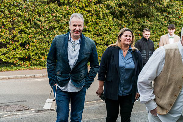 People walking on suburban street.