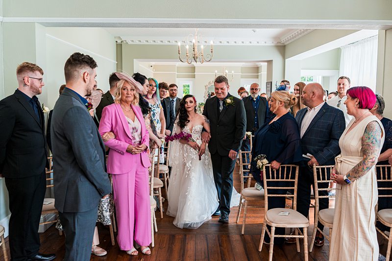 Bride and groom walking down the aisle.