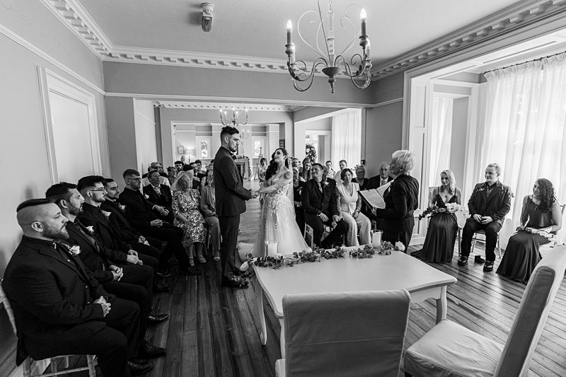 Bride and groom exchanging vows during ceremony.