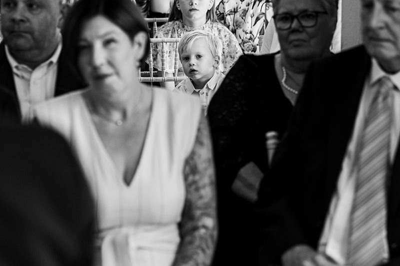 A child looking through the crowd at an event.