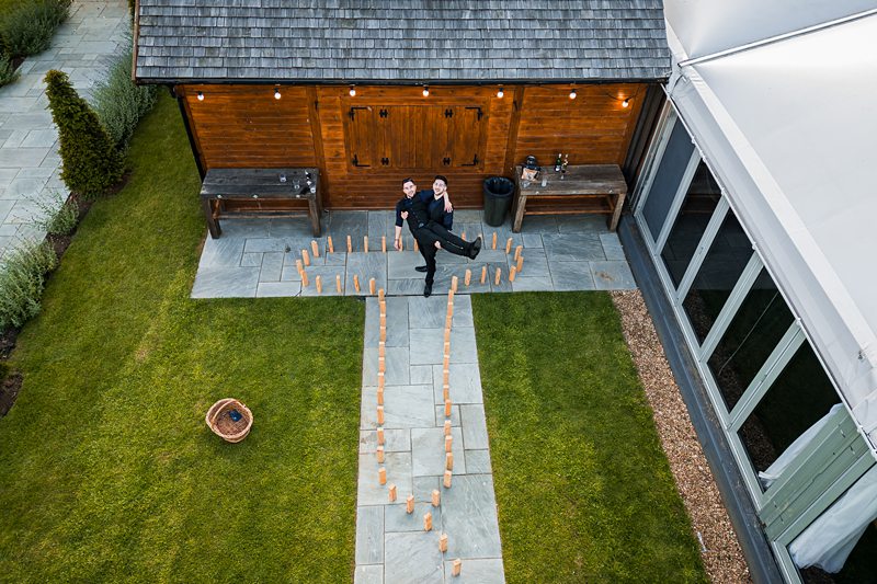 Aerial view of wedding guests and garden venue.