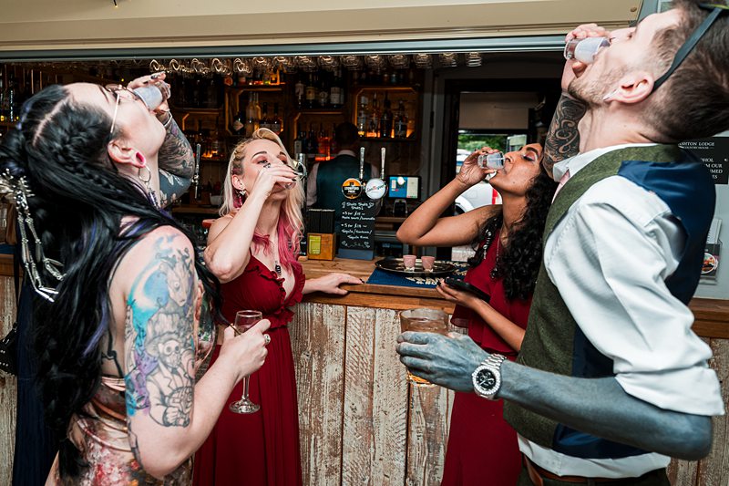Group taking shots at the bar.