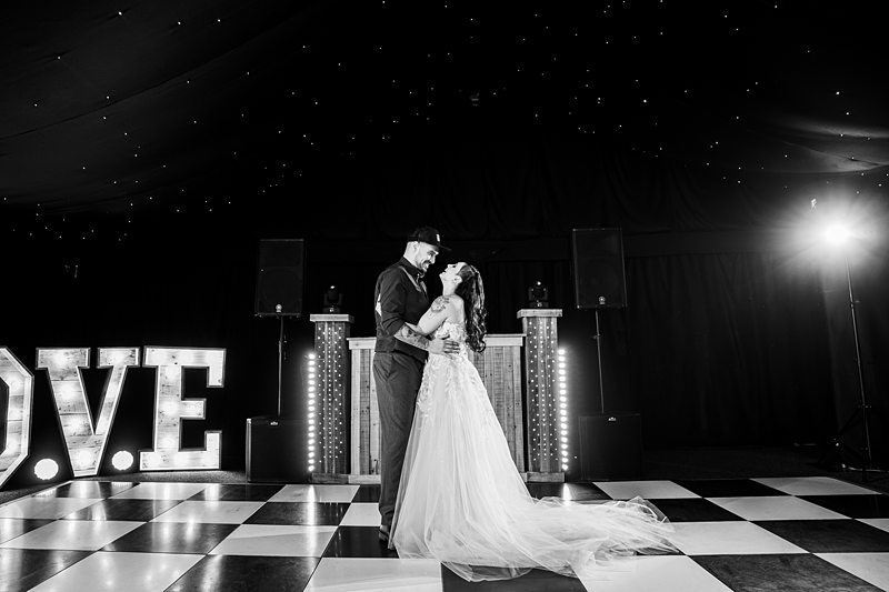 Bride and groom's first dance, black and white photo.