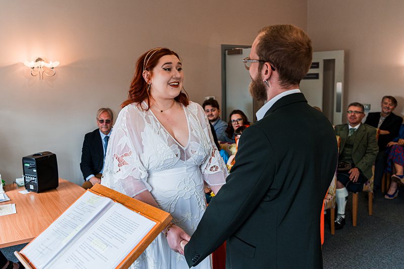Couple exchanging vows at a wedding ceremony.
