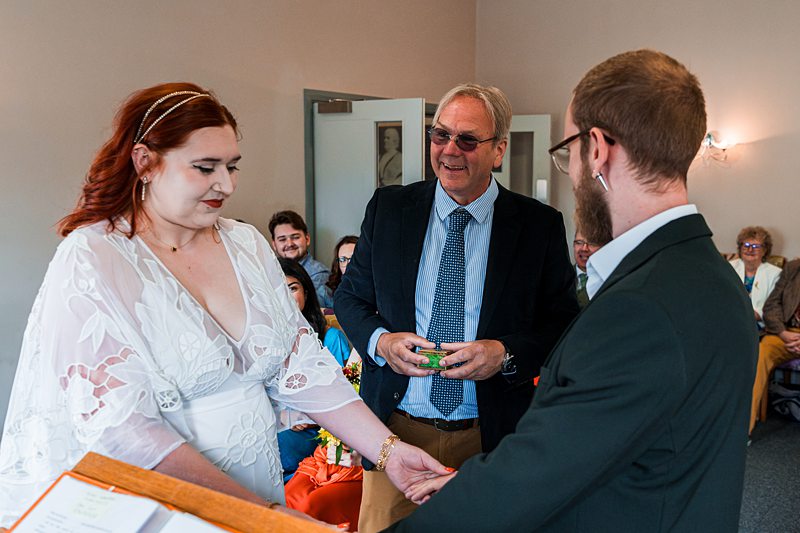 Couple exchanging vows in wedding ceremony.