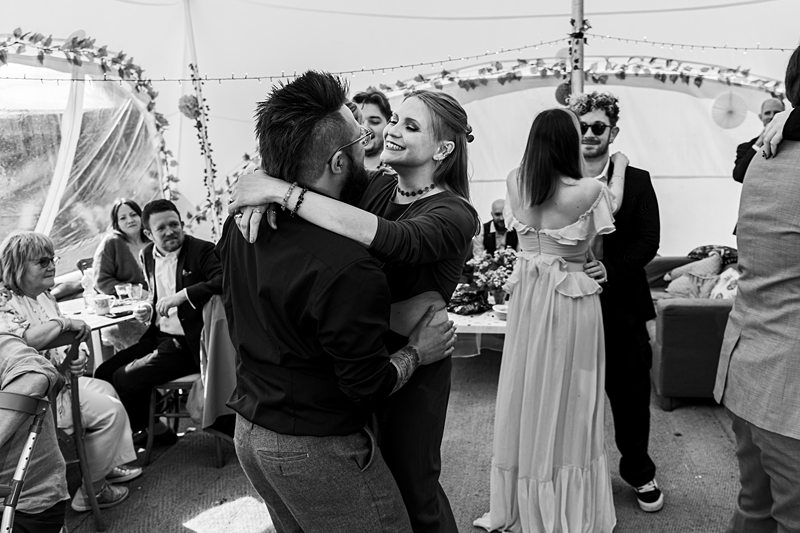 Guests dancing at a wedding reception.