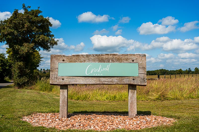 Crockwell Farm wooden sign in countryside
