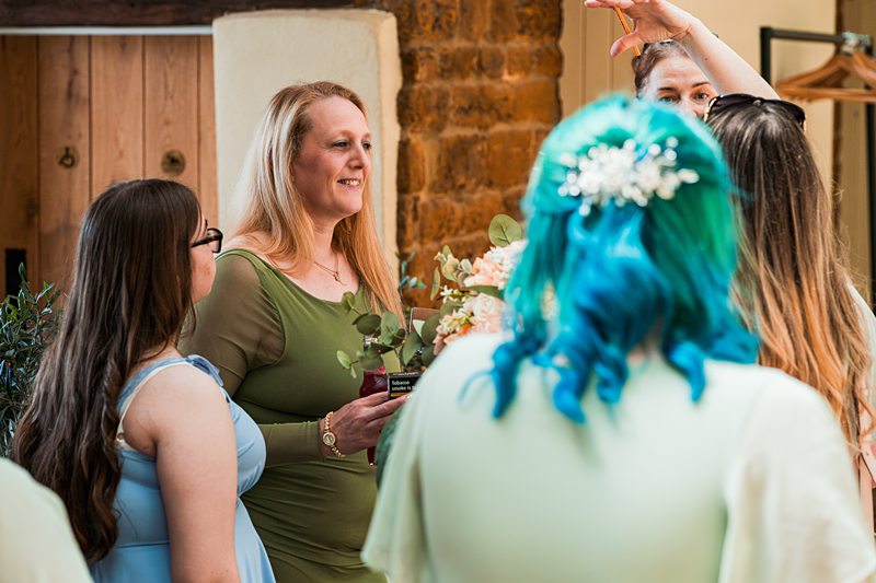 Women conversing at a wedding celebration.