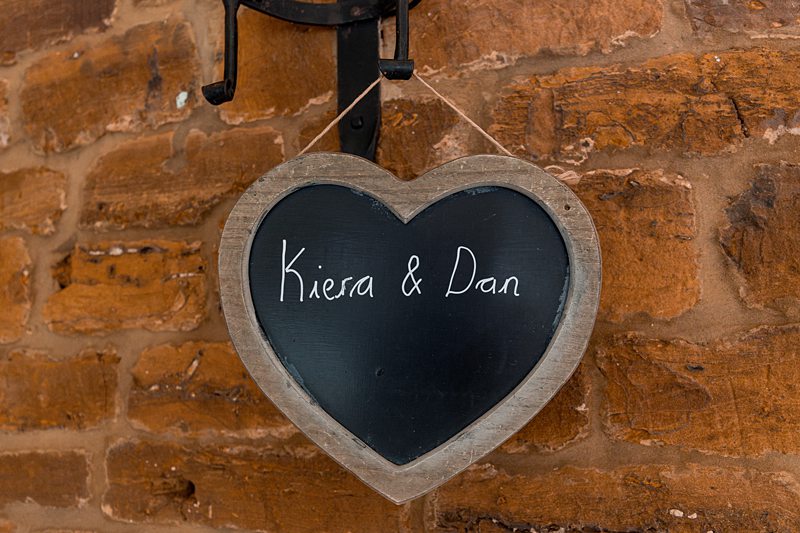 Heart sign on brick wall, Kiera & Dan