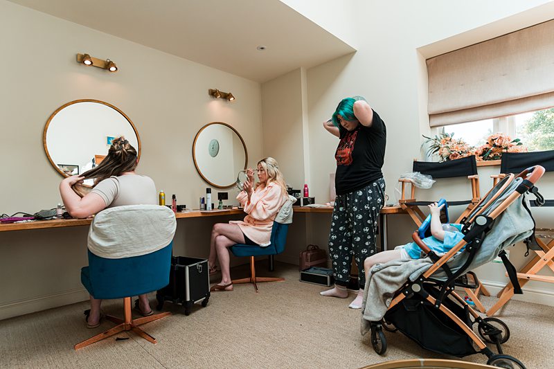 People getting ready at dressing table