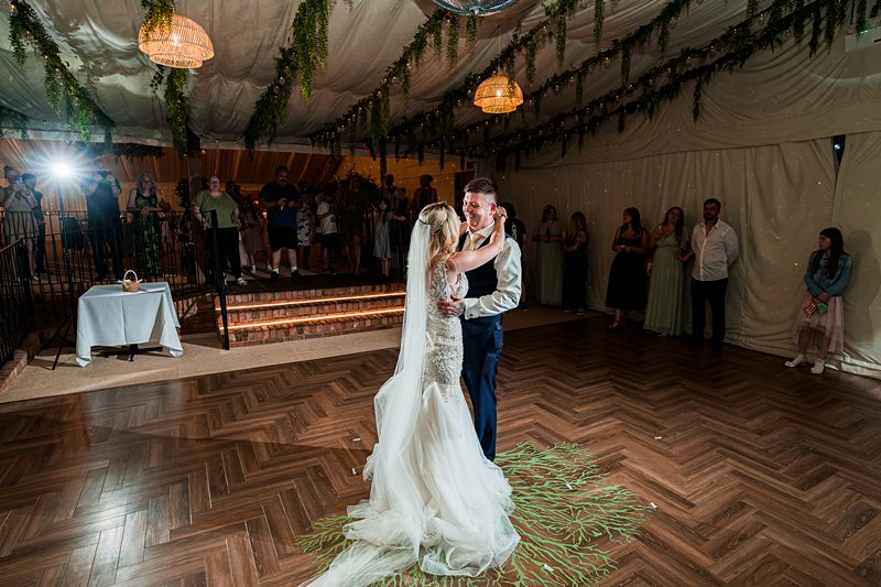 Bride and groom dancing at wedding reception
