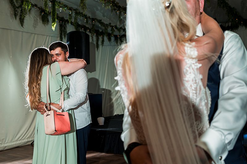 Couples dancing at a wedding reception.