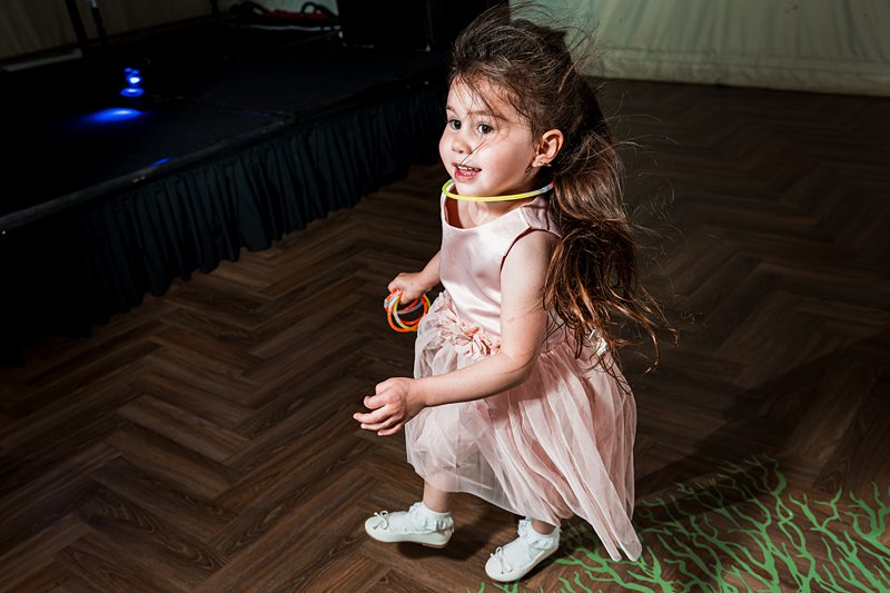 Little girl in pink dress dancing