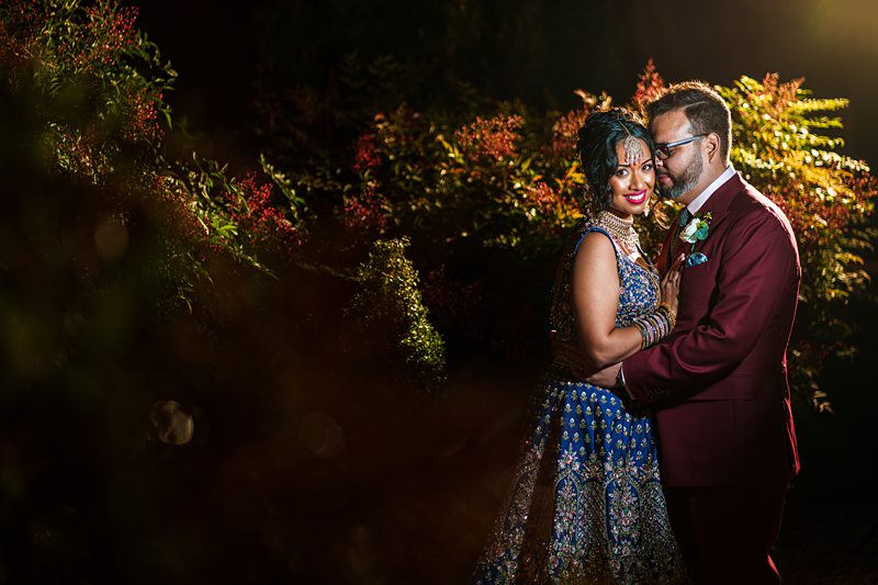 Couple in formal attire embracing outdoors