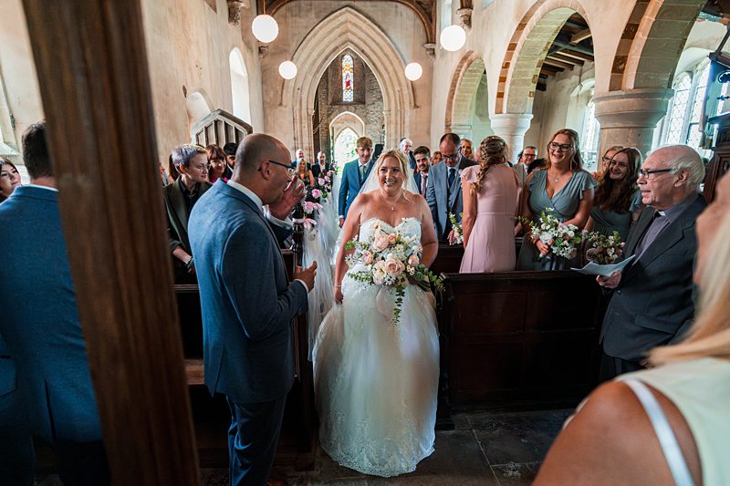 Bride walking down the aisle in a church