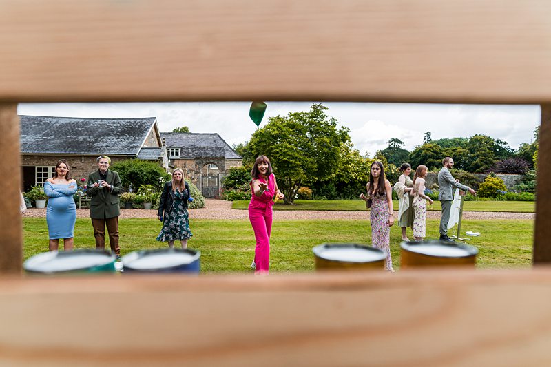 People playing outdoor game at countryside event.