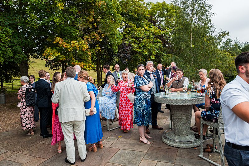 Outdoor gathering of people socialising at an event.