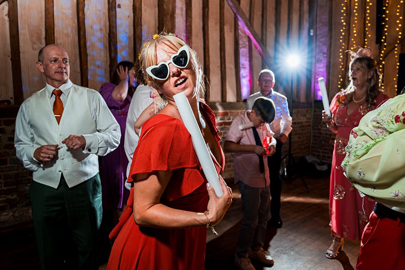 People dancing joyfully at a festive celebration.
