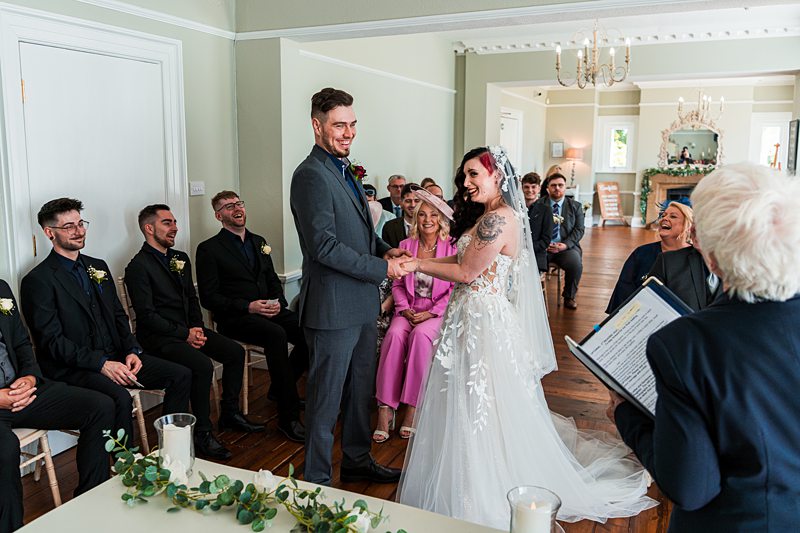 Wedding ceremony with bride and groom exchanging vows.