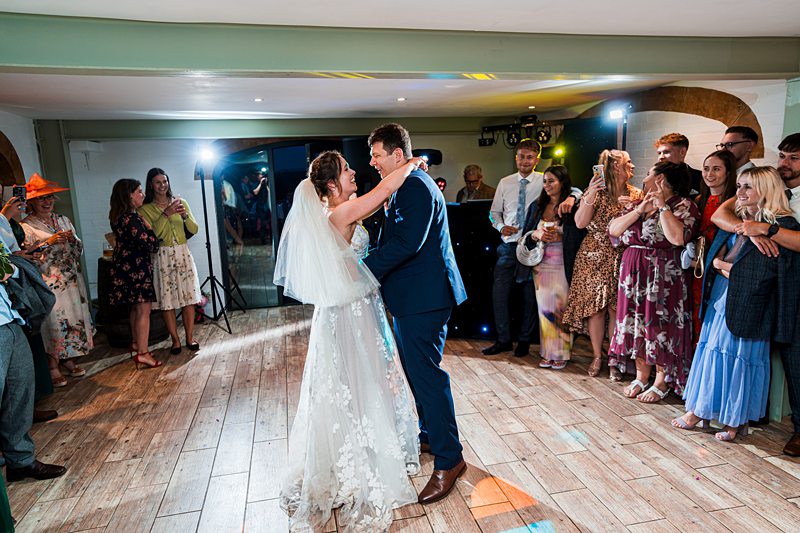 Bride and groom dancing at wedding reception