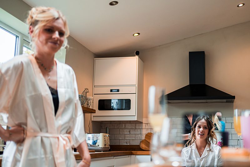 Women in kitchen preparing for an event.